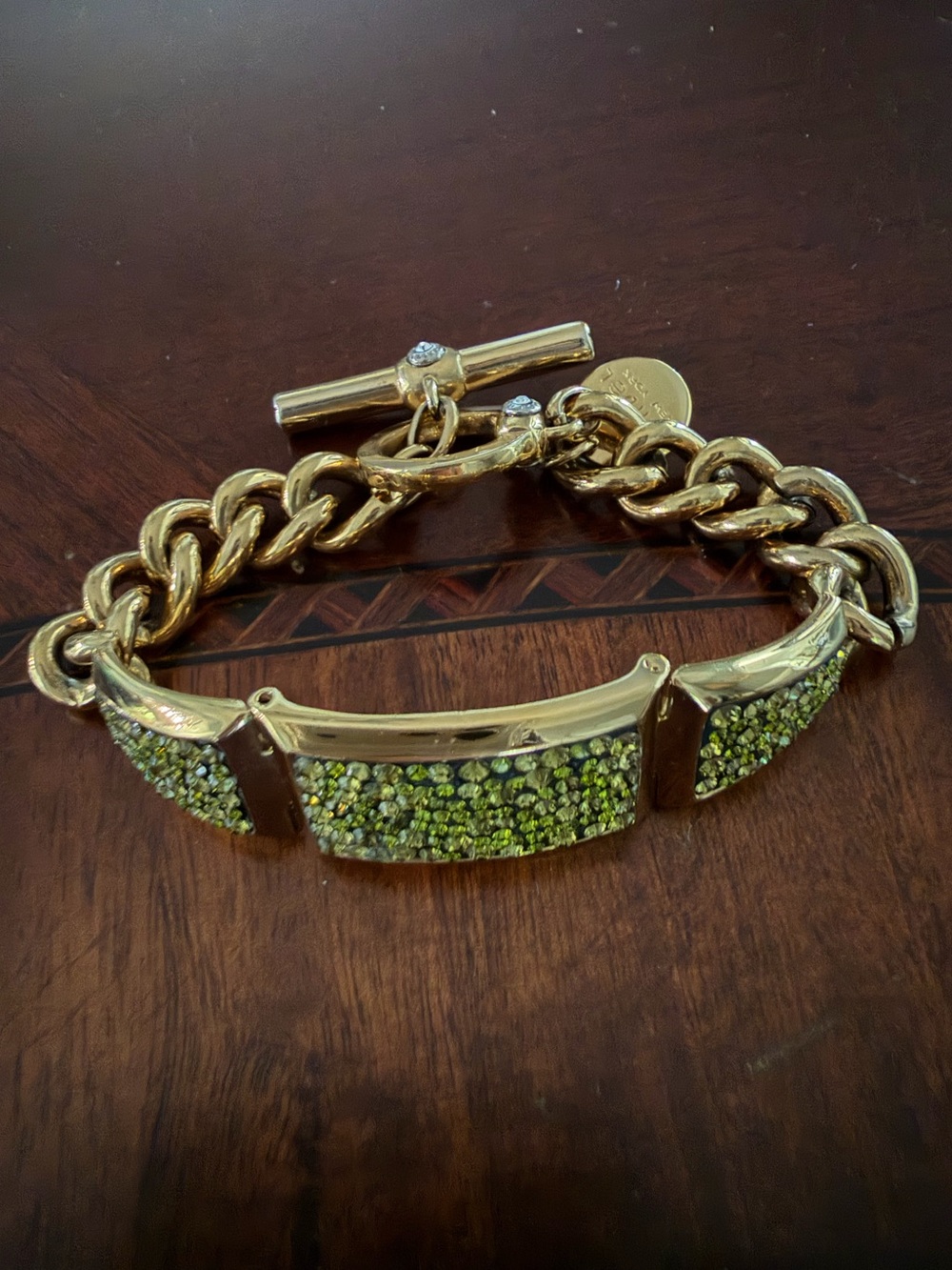 Henri Bendel Gold Tone Bracelet with Green Crystals Toggle Closure 7.5”